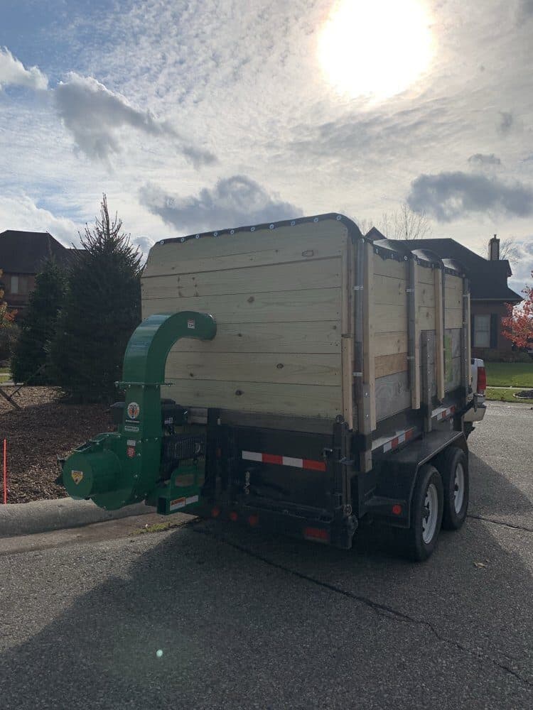Trusted Landscaping haul-away trailer at a cleanup job
