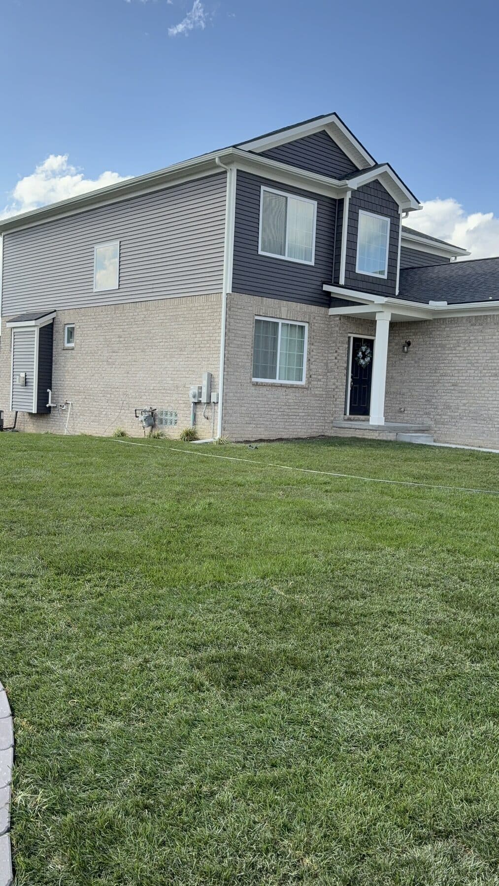 The same project with the new lawn established and edged